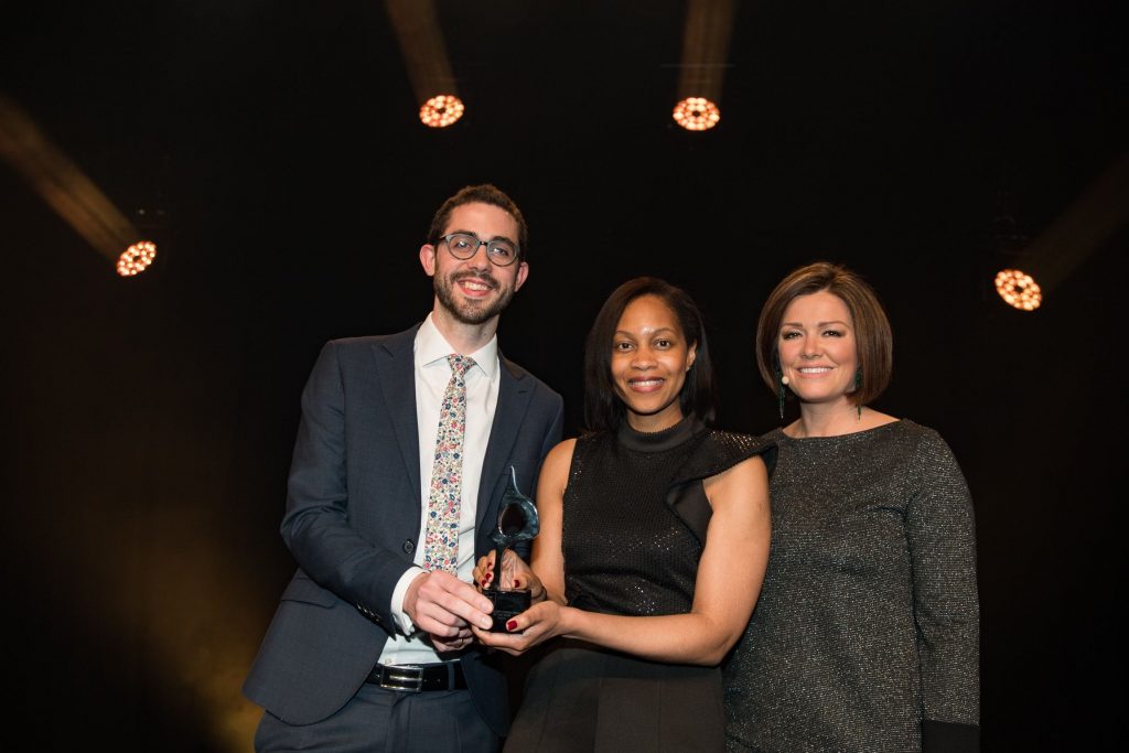 Man Bites Dog holding the SABRE award with Korn Ferry